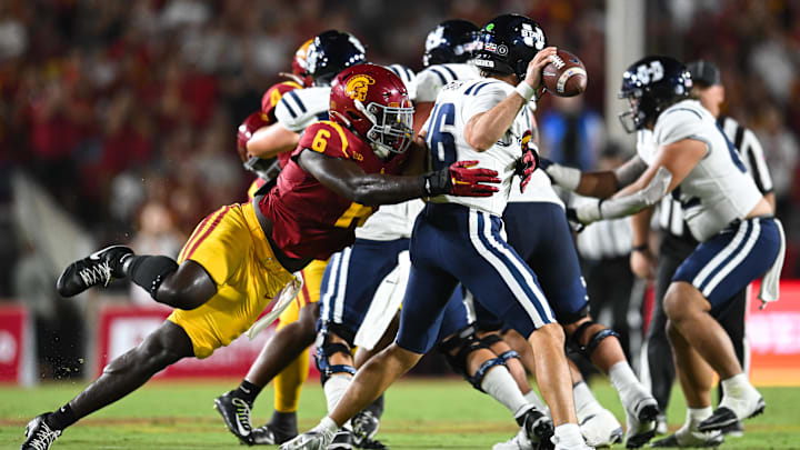 Sep 7, 2024; Los Angeles, California, USA; USC Trojans defensive end Anthony Lucas (6) attempts to sack Utah State Aggies quarterback Bryson Barnes (16) during the second quarter at United Airlines Field at Los Angeles Memorial Coliseum.