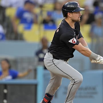 Sep 7, 2024; Los Angeles, California, USA;  Cleveland Guardians right fielder Lane Thomas (8) hits a two-run home run in the second inning against the Los Angeles Dodgers at Dodger Stadium. Mandatory Credit: Jayne Kamin-Oncea-Imagn Images