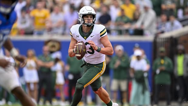  Baylor Bears quarterback Sawyer Robertson (13) rolls out with the ball during the second half against the SMU Mustangs