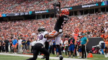 Cincinnati Bengals wide receiver Tee Higgins (5) catches a touchdown as Baltimore Ravens safety