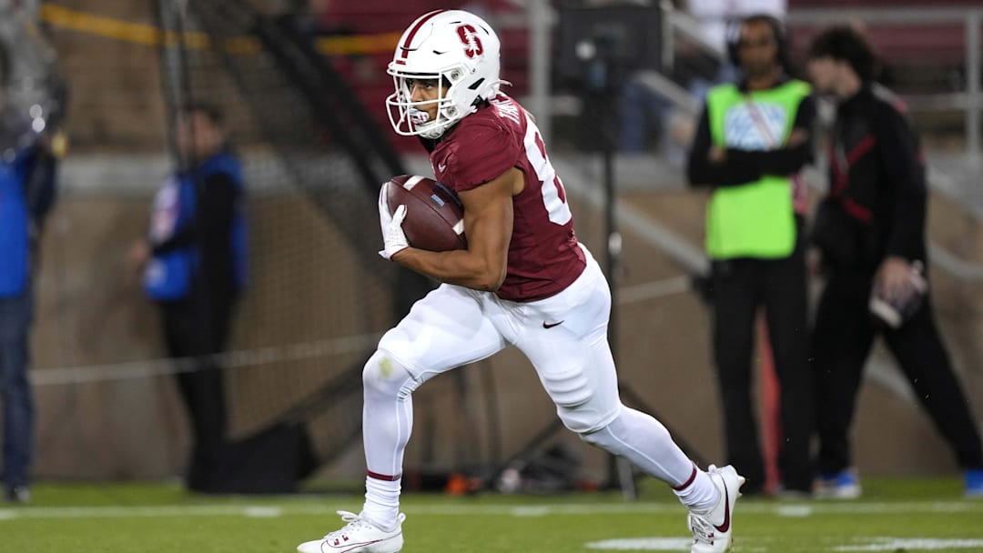 Oct 21, 2023; Stanford, California, USA; Stanford Cardinal wide receiver Jason Thompson (87) returns a kick against the UCLA Bruins during the second quarter at Stanford Stadium. Mandatory Credit: Darren Yamashita-Imagn Images