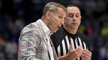 Mar 15, 2025; Nashville, TN, USA;  Alabama Crimson Tide head coach Nate Oats talks with a referee against the Florida Gators during the second half at Bridgestone Arena. Mandatory Credit: Steve Roberts-Imagn Images