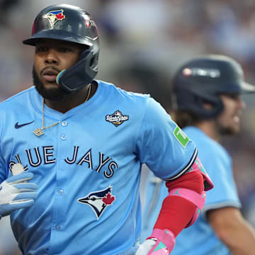 Oct 28, 2025; Los Angeles, California, USA; Toronto Blue Jays first baseman Vladimir Guerrero Jr. (27) celebrates after hitting a two run home run against the Los Angeles Dodgers in the third inning during game four of the 2025 MLB World Series at Dodger Stadium. 