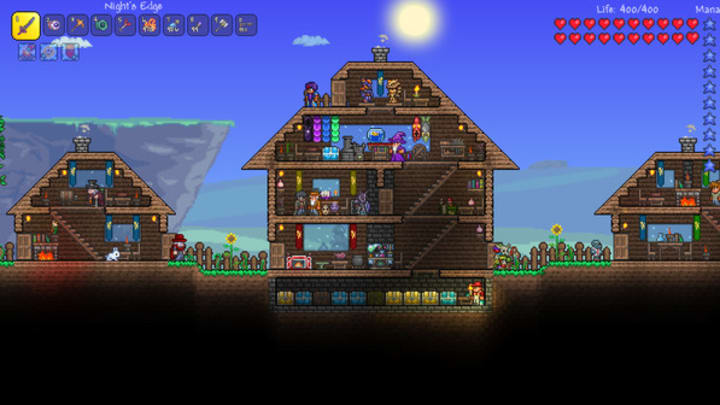 A side on view of three houses in Terraria