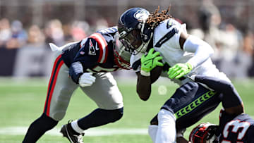 Sep 15, 2024; Foxborough, Massachusetts, USA; Seattle Seahawks wide receiver Laviska Shenault Jr. (1) is tackled by New England Patriots linebacker Raekwon McMillan (50) during the first half at Gillette Stadium. Mandatory Credit: Brian Fluharty-Imagn Images