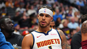 Oct 15, 2024; Denver, Colorado, USA; Denver Nuggets forward Michael Porter Jr. (1) on the bench in the second half against the Oklahoma City Thunder at Ball Arena. Mandatory Credit: Ron Chenoy-Imagn Images
