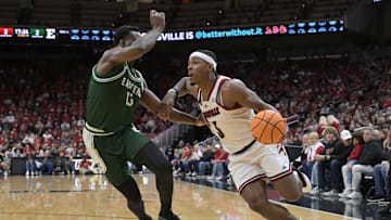 Nov 24, 2025; Louisville, Kentucky, USA; Louisville Cardinals guard Ryan Conwell (3) drives to the basket against Eastern Michigan Eagles forward Godslove Nwabude (13) during the first half at KFC Yum! Center. Mandatory Credit: Jamie Rhodes-Imagn Images