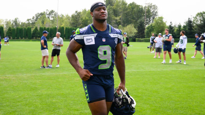 Jul 27, 2024; Renton, WA, USA; Seattle Seahawks running back Kenneth Walker III (9) jogs off the field after training camp at Virginia Mason Athletic Center. Mandatory Credit: Steven Bisig-USA TODAY Sports