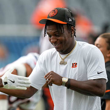 Cincinnati Bengals cornerback Mike Hilton (21) greets his teammates during warmups before the NFL Preseason Week 2 game between the Chicago Bears and the Cincinnati Bengals at Soldier Field in downtown Chicago on Saturday, Aug. 17, 2024.