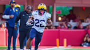 Sep 20, 2025; Lincoln, Nebraska, USA; Michigan Wolverines running back Jordan Marshall (23) runs against the Nebraska Cornhuskers during the fourth quarter at Memorial Stadium. Mandatory Credit: Dylan Widger-Imagn Images