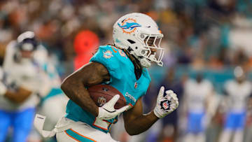 Sep 30, 2024; Miami Gardens, Florida, USA; Miami Dolphins running back Jaylen Wright runs with the football against the Tennessee Titans during the second quarter at Hard Rock Stadium. 