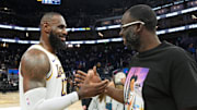 Jan 25, 2025; San Francisco, California, USA; Los Angeles Lakers forward LeBron James talks with Golden State Warriors forward Draymond Green after the game at Chase Center.