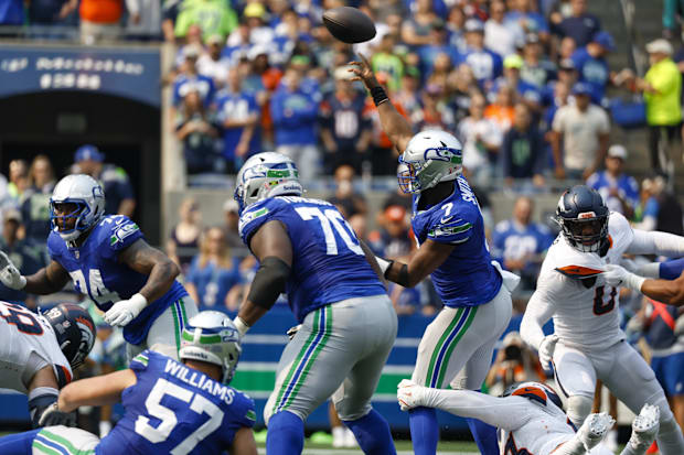 Seattle Seahawks quarterback Geno Smith (7) throws an interception against the Denver Broncos.