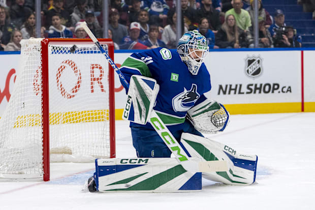 Hockey goalie stops shot attemp