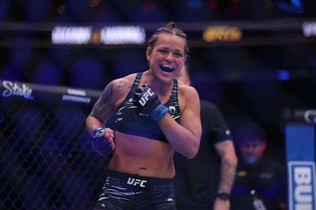 Eduarda Moura (blue gloves) celebrates after defeating Veronica Hardy (red gloves) in the flyweight bout during UFC 309.