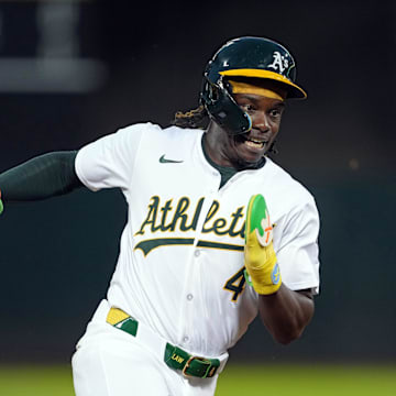 Sep 6, 2024; Oakland, California, USA; Oakland Athletics right fielder Lawrence Butler (4) runs to third base against the Detroit Tigers during the fourth inning at Oakland-Alameda County Coliseum.