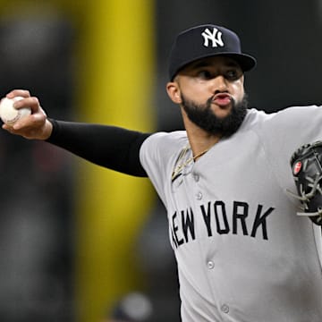 Aug 4, 2025; Arlington, Texas, USA; New York Yankees relief pitcher Devin Williams (38) pitches against the Texas Rangers during the ninth inning at Globe Life Field. Mandatory Credit: Jerome Miron-Imagn Images