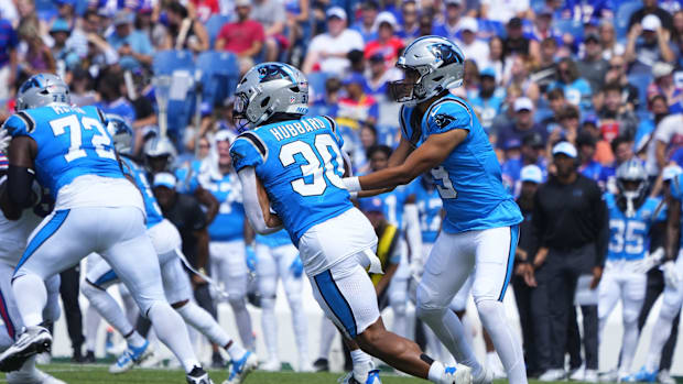  Carolina Panthers quarterback Bryce Young (9) hands the ball off to Carolina Panthers running back Chuba Hubbard (30) agains