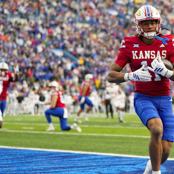 Nov 1, 2025; Lawrence, Kansas, USA; Kansas Jayhawks wide receiver Bryson Canty (11) scores a touchdown during the second half against the Oklahoma State Cowboys at David Booth Kansas Memorial Stadium. Mandatory Credit: Jay Biggerstaff-Imagn Images