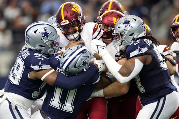 Commanders QB Jayden Daniels is sacked by Dallas Cowboys linebacker Micah Parsons.