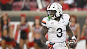 Oct 4, 2025; Louisville, Kentucky, USA; Virginia Cavaliers running back J'Mari Taylor (3) celebrates a touchdown during overtime against the Louisville Cardinals at L&N Federal Credit Union Stadium. Virginia defeated Louisville 30-27. Mandatory Credit: Jamie Rhodes-Imagn Images