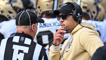 Purdue Boilermakers head coach Ryan Walters talks with an official