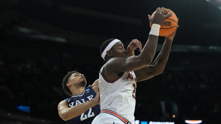 Mar 22, 2024; Spokane, WA, USA; Auburn Tigers forward Jaylin Williams (2) rebounds the ball against Yale Bulldogs forward Matt Knowling (22) during the first half of a game in the first round of the 2024 NCAA Tournament at Spokane Veterans Memorial Arena. Mandatory Credit: Kirby Lee-USA TODAY Sports 