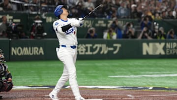 Mar 16, 2025; Bunkyo, Tokyo, Japan; Los Angeles Dodgers designated hitter Shohei Ohtani (17) bats against the Hanshin Tigers during the third inning at Tokyo Dome. Mandatory Credit: Darren Yamashita-Imagn Images