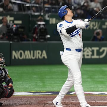 Mar 16, 2025; Bunkyo, Tokyo, Japan; Los Angeles Dodgers designated hitter Shohei Ohtani (17) bats against the Hanshin Tigers during the third inning at Tokyo Dome. Mandatory Credit: Darren Yamashita-Imagn Images