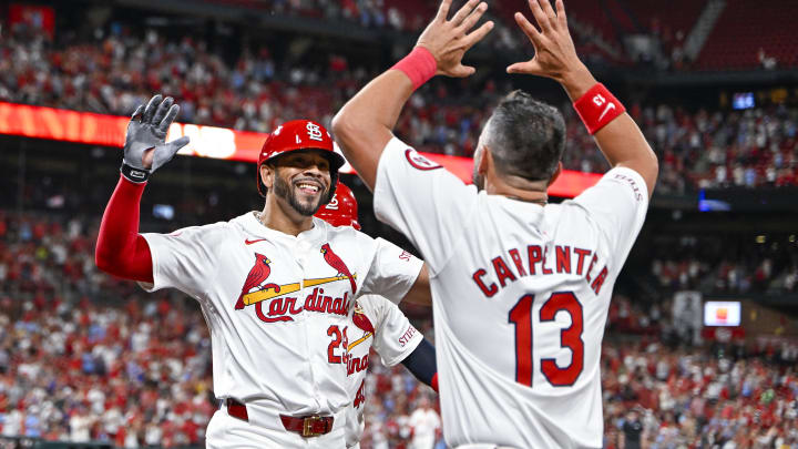 Jul 30, 2024; St. Louis, Missouri, USA;  St. Louis Cardinals pinch hitter Tommy Pham (29) celebrates with Matt Carpenter (13) after hitting a grand slam home run against the Texas Rangers during the fifth inning at Busch Stadium. Mandatory Credit: Jeff Curry-USA TODAY Sports