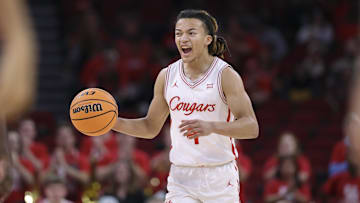 Dec 6, 2025; Houston, TX, USA; Houston Cougars guard Kingston Flemings (4) dribbles the ball during the first half against the Florida State Seminoles at Toyota Center. Mandatory Credit: Troy Taormina-Imagn Images