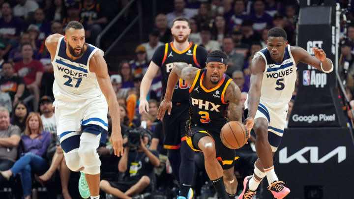 Apr 26, 2024; Phoenix, Arizona, USA; Phoenix Suns guard Bradley Beal (3) dribbles by Minnesota Timberwolves guard Anthony Edwards (5) during the second half of game three of the first round for the 2024 NBA playoffs at Footprint Center. Mandatory Credit: Joe Camporeale-USA TODAY Sports