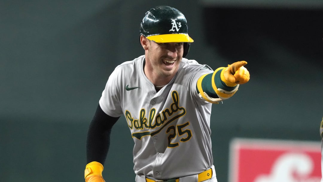 Jun 29, 2024; Phoenix, Arizona, USA; Oakland Athletics outfielder Brent Rooker (25) reacts after hitting a single against the Arizona Diamondbacks in the first inning at Chase Field. Mandatory Credit: Rick Scuteri-USA TODAY Sports