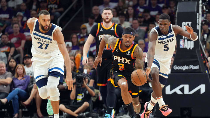 Apr 26, 2024; Phoenix, Arizona, USA; Phoenix Suns guard Bradley Beal (3) dribbles by Minnesota Timberwolves guard Anthony Edwards (5) during the second half of game three of the first round for the 2024 NBA playoffs at Footprint Center. Mandatory Credit: Joe Camporeale-USA TODAY Sports
