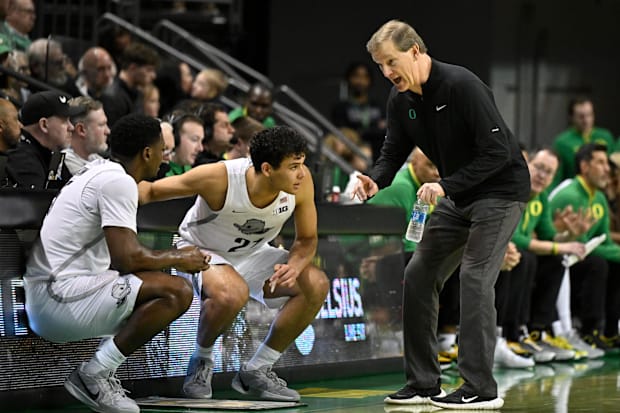 Oregon Ducks head coach Dana Altman gives player instructions during the first half against the Nebraska Cornhuskers.