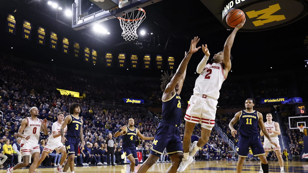 Wisconsin Badgers guard Nick Boyd (2) shoots on Michigan Wolverines forward Morez Johnson Jr. (21) in the second half at Crisler Center