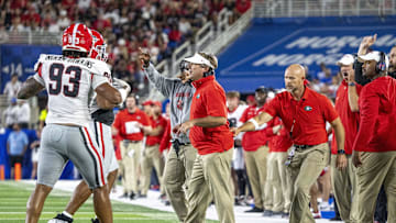 Sep 14, 2024; Lexington, Kentucky, USA; Georgia Bulldogs head coach Kirby Smart is pulled off the field during the third quarter of the game against the Kentucky Wildcats at Kroger Field. Mandatory Credit: Tanner Pearson-Imagn Images