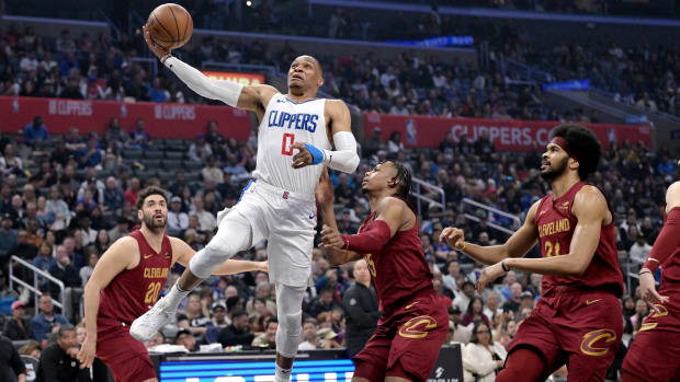 Apr 7, 2024; Los Angeles, California, USA; Los Angeles Clippers guard Russell Westbrook (0) drives past Cleveland Cavaliers forward Isaac Okoro (35) in the first half at Crypto.com Arena. Mandatory Credit: Jayne Kamin-Oncea-USA TODAY Sports