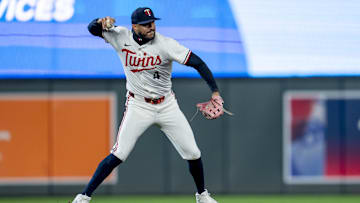 Apr 14, 2025; Minneapolis, Minnesota, USA; Minnesota Twins shortstop Carlos Correa (4) throws the ball to first base for an out against the New York Mets in the ninth inning at Target Field.