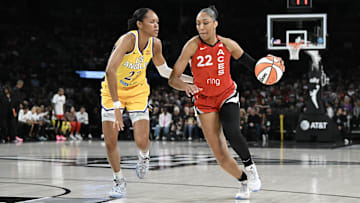 Las Vegas Aces center Wilson drives past Los Angeles Sparks forward Stevens at Michelob Ultra Arena. 