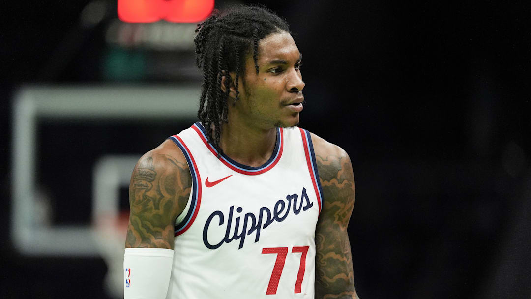 Jan 31, 2025; Charlotte, North Carolina, USA; LA Clippers guard Kevin Porter Jr. (77) reacts to a call during the second quarter against the Charlotte Hornets at Spectrum Center. 