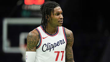 Jan 31, 2025; Charlotte, North Carolina, USA; LA Clippers guard Kevin Porter Jr. (77) reacts to a call during the second quarter against the Charlotte Hornets at Spectrum Center. 