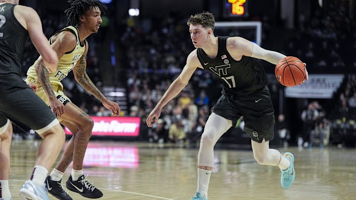 Jan 3, 2026; Winston-Salem, North Carolina, USA; Virginia Tech Hokies guard Neoklis Avdalas (17) handles the ball defended by Wake Forest Demon Deacons guard Juke Harris (2) during the second half at Lawrence Joel Veterans Memorial Coliseum. Mandatory Credit: Jim Dedmon-Imagn Images