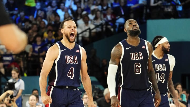 Aug 10, 2024; Paris, France; United States shooting guard Stephen Curry (4) and guard LeBron James (6) react in the second half against France in the men's basketball gold medal game during the Paris 2024 Olympic Summer Games at Accor Arena. Mandatory Credit: Rob Schumacher-USA TODAY Sports