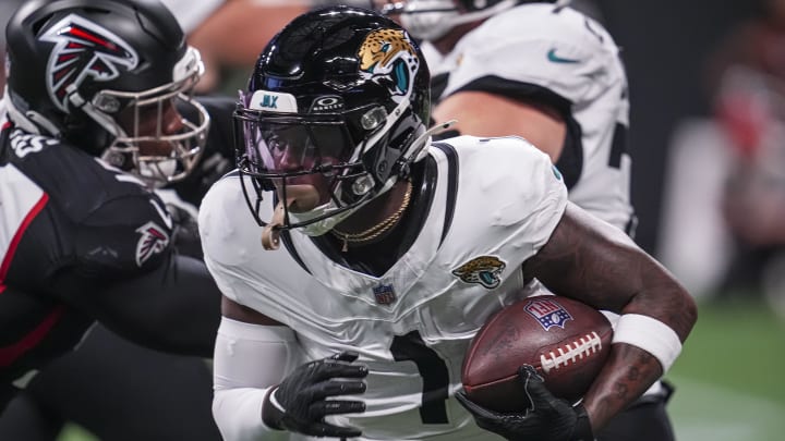 Aug 23, 2024; Atlanta, Georgia, USA; Jacksonville Jaguars running back Travis Etienne Jr. (1) runs against the Atlanta Falcons during the first half at Mercedes-Benz Stadium. Mandatory Credit: Dale Zanine-USA TODAY Sports