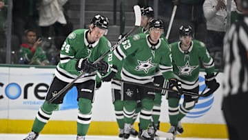 Jan 24, 2025; Dallas, Texas, USA; Dallas Stars center Roope Hintz (24) and right wing Evgenii Dadonov (63) and center Mavrik Bourque (22) skate off the ice after Hintz scores a goal against the Vegas Golden Knights during the first period at the American Airlines Center. Mandatory Credit: Jerome Miron-Imagn Images
