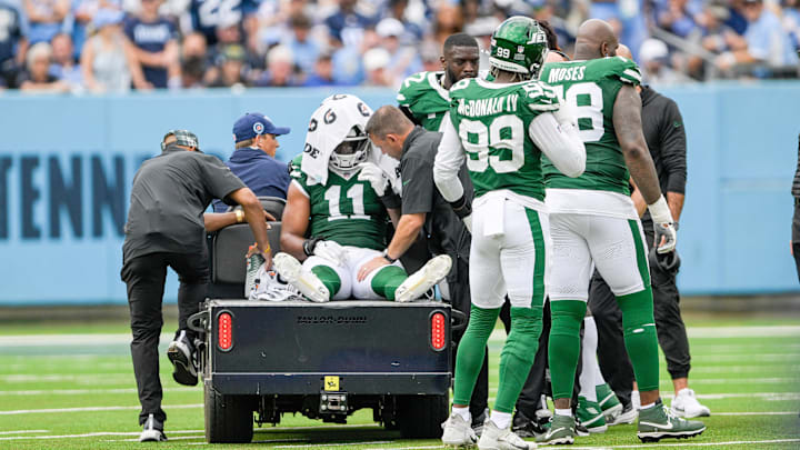 Sep 15, 2024; Nashville, Tennessee, USA;  New York Jets linebacker Jermaine Johnson (11) is carted off against the Tennessee Titans during the second half at Nissan Stadium. 