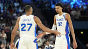 Aug 8, 2024; Paris, France; France centre Rudy Gobert (27) and power forward Victor Wembanyama (32) celebrate during the first half against Germany in a men's basketball semifinal game during the Paris 2024 Olympic Summer Games at Accor Arena. Mandatory Credit: Kyle Terada-Imagn Images