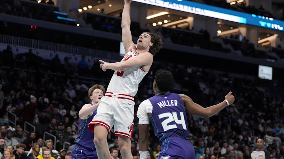 Bulls guard Josh Giddey drives to the basket against Hornets guard Kon Knueppel and forward Brandon Miller.