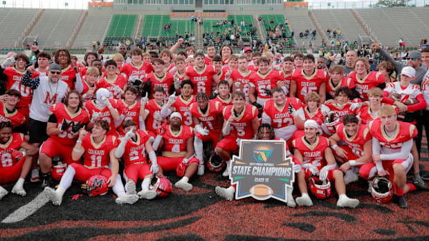 Cardinal Mooney won its first state title since 1972, defeating Trinity Catholic 31-27 